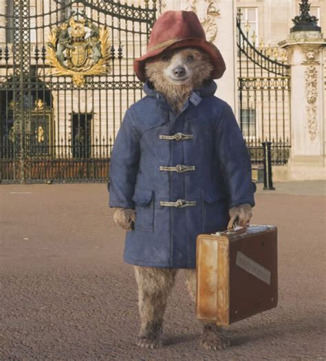 Afbeelding van Beertje Paddington die thee drinkt met de Koningin