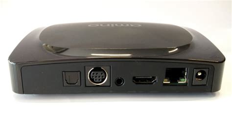Afbeelding van de Amino tv-box interface met de instellingen-icoon gemarkeerd.
