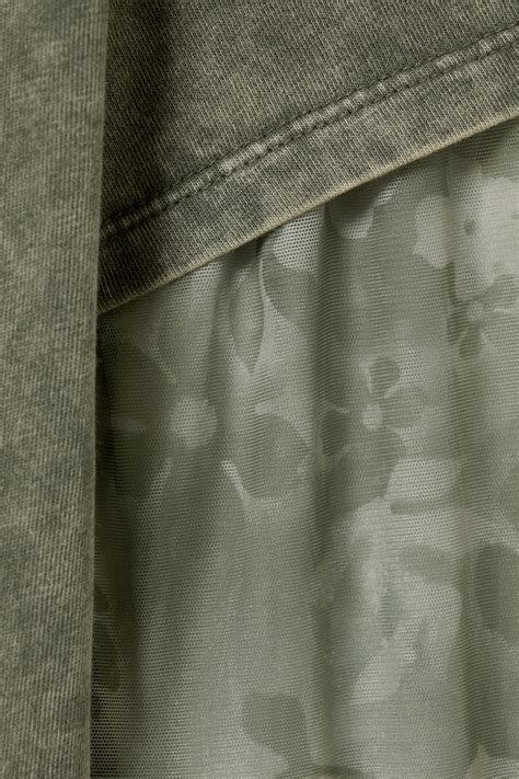 Schema van een dubbellaagse DVD met de twee lagen en de laser die de data leest.