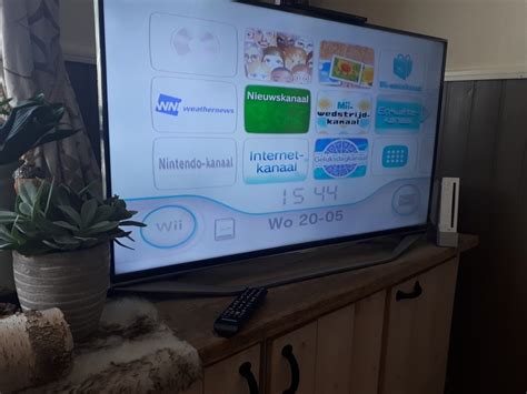 Diagram van een Wii die via een AV-HDMI converter is aangesloten op een smart TV.